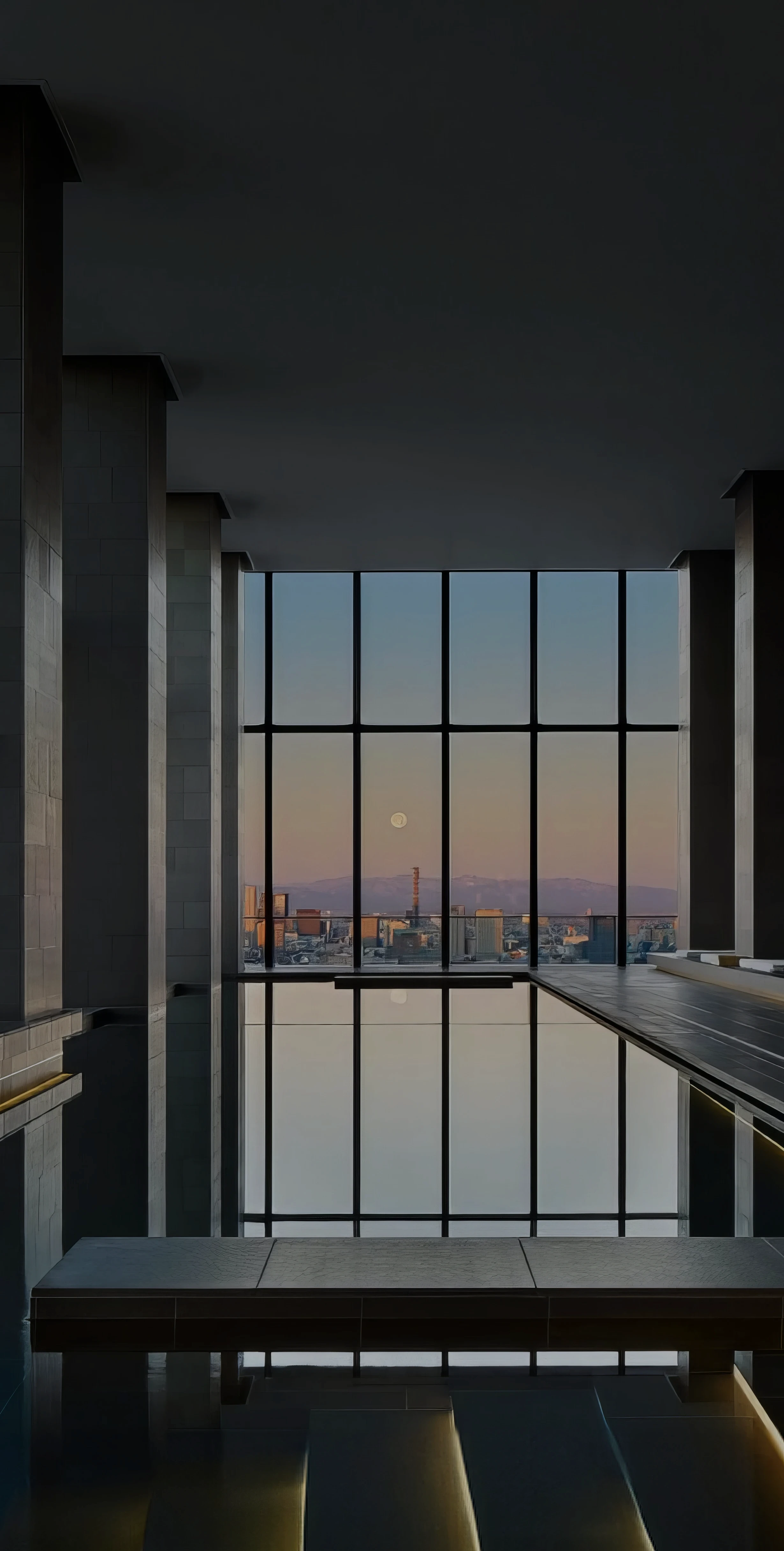 An image of a tranquil indoor swimming pool and spa overlooking the Tokyo skyline at Aman Tokyo hotel in Tokyo, Japan.